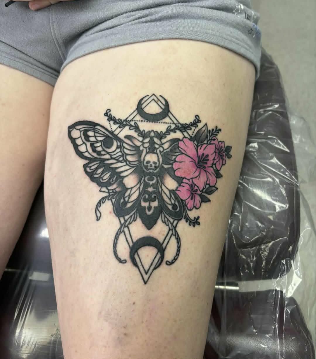 Death moth with hibiscus and geometric line work