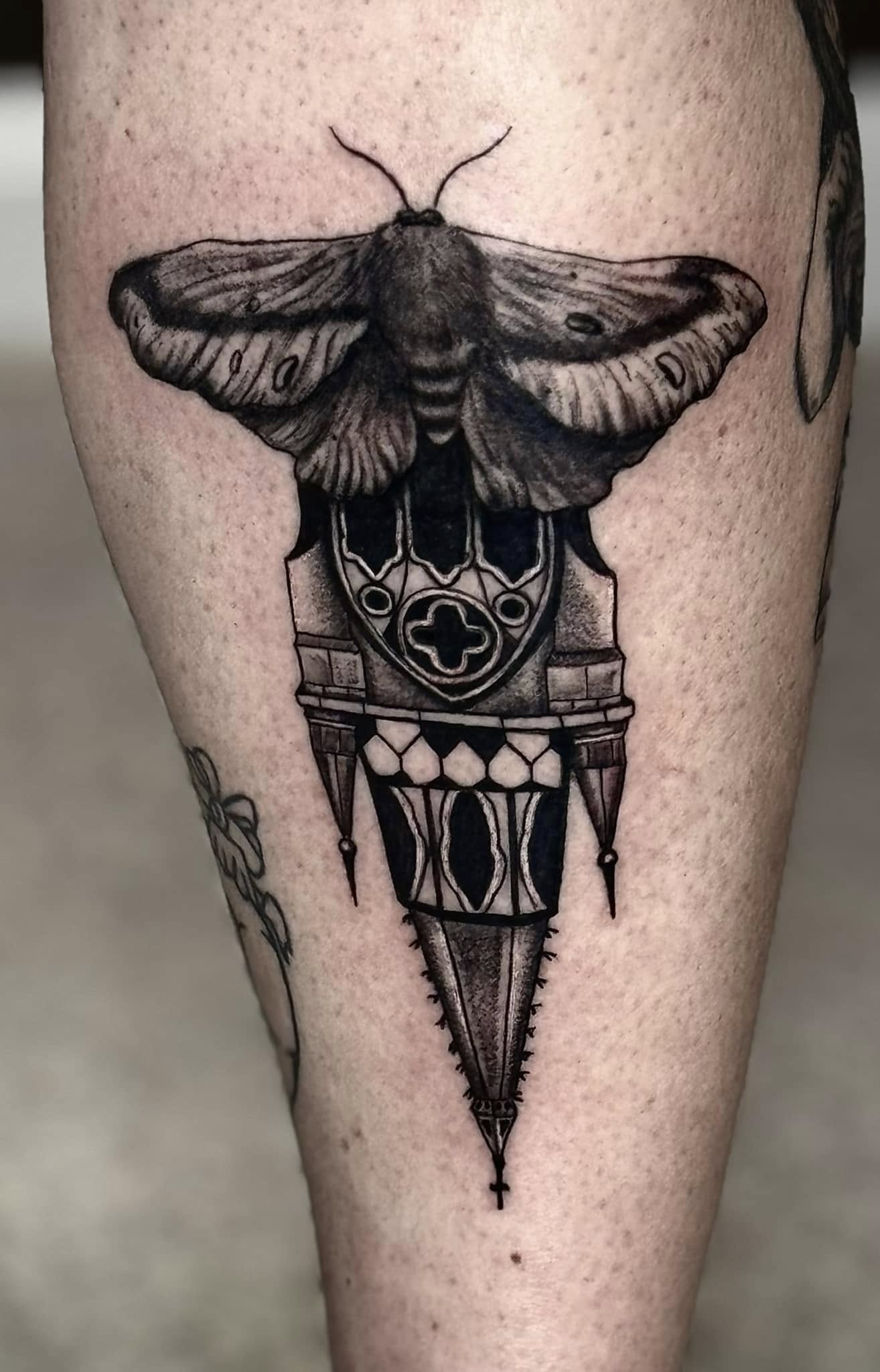 Death moth over gothic cathedral spire