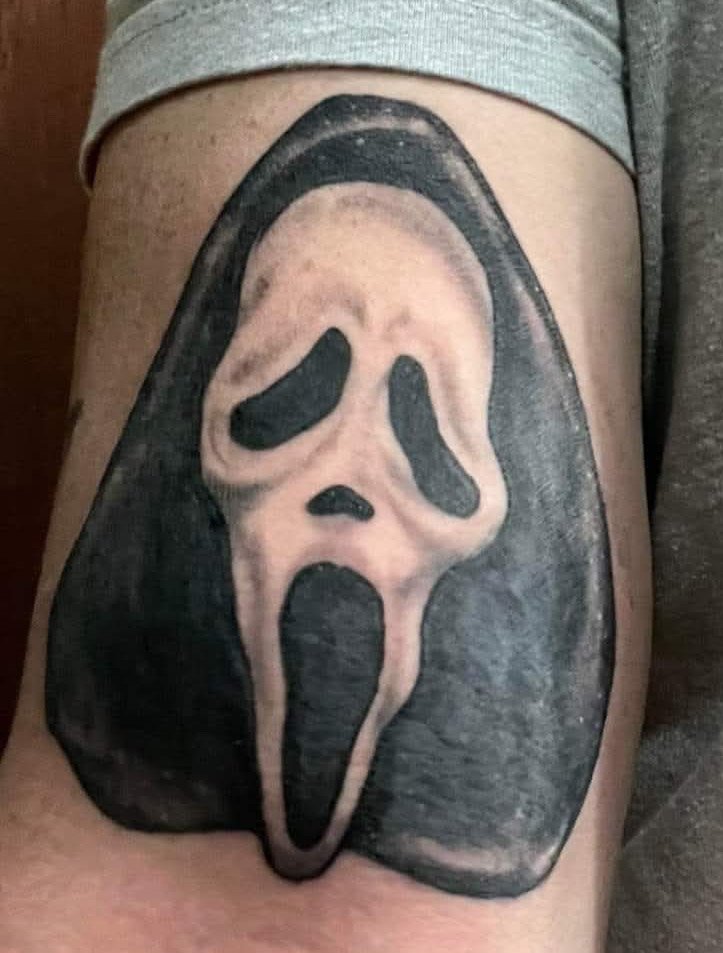 Black and grey Ghostface Scream mask tattoo