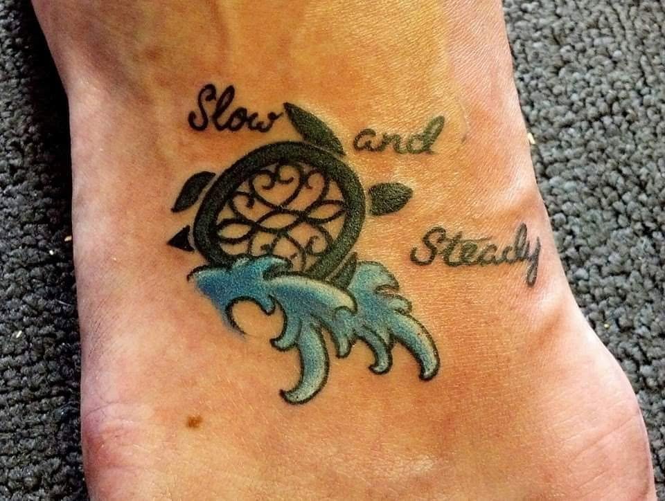 Sea turtle with slow and steady lettering